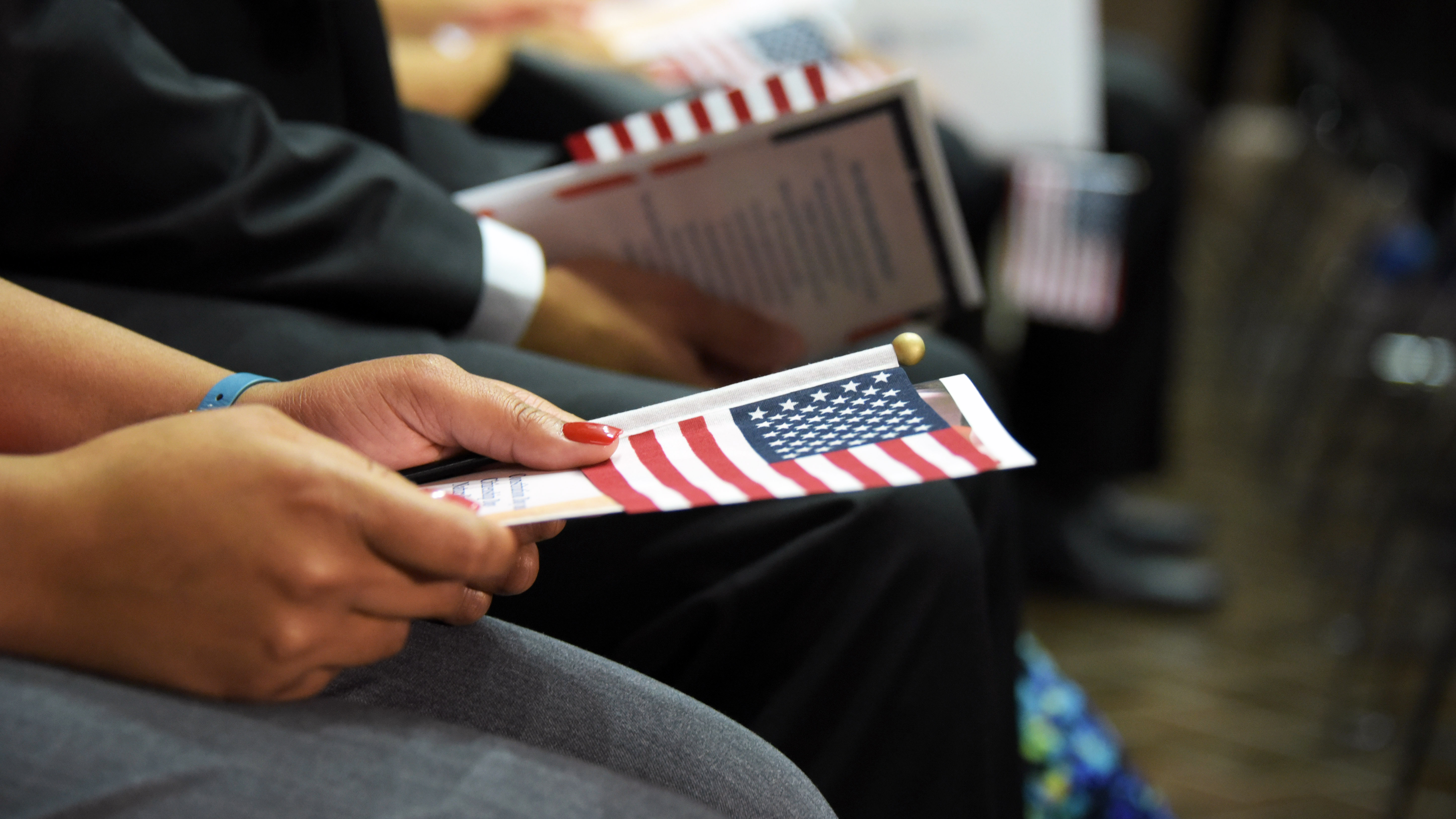 Flags held during a naturalization ceremony