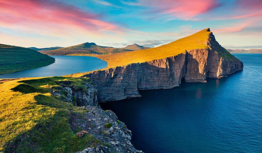Panoramic morning view of Sorvagsvatn lake, Vagar, Faroe Islands, Denmark, Europe. Exciting summer seascape of Atlantic Ocean. Beauty of nature concept background.