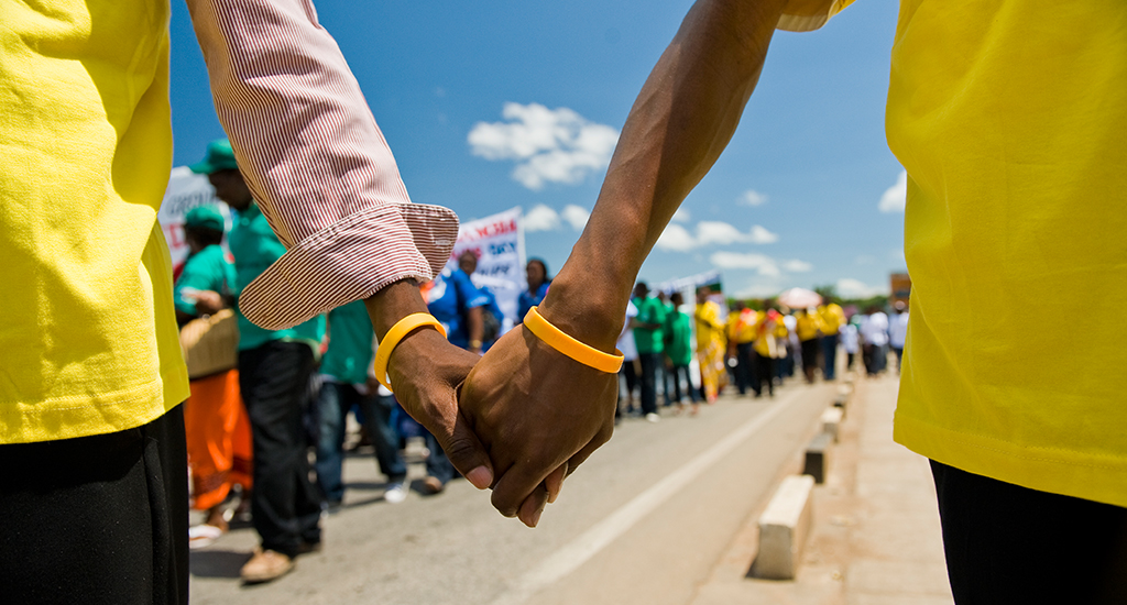 Men Holding Hands In Mozambique