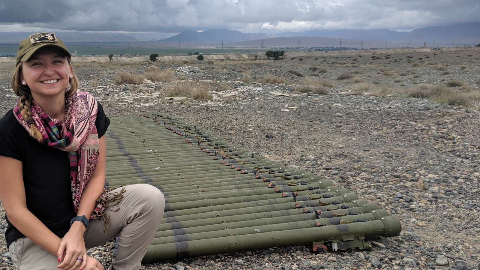Aimee Falkun, the Strategic Advisor with the PM Bureau’s Office of Weapons Removal and Abatement, inspects MANPADS tubes set out for destruction, Kyrgyz Republic, 2019. (State Department photo)