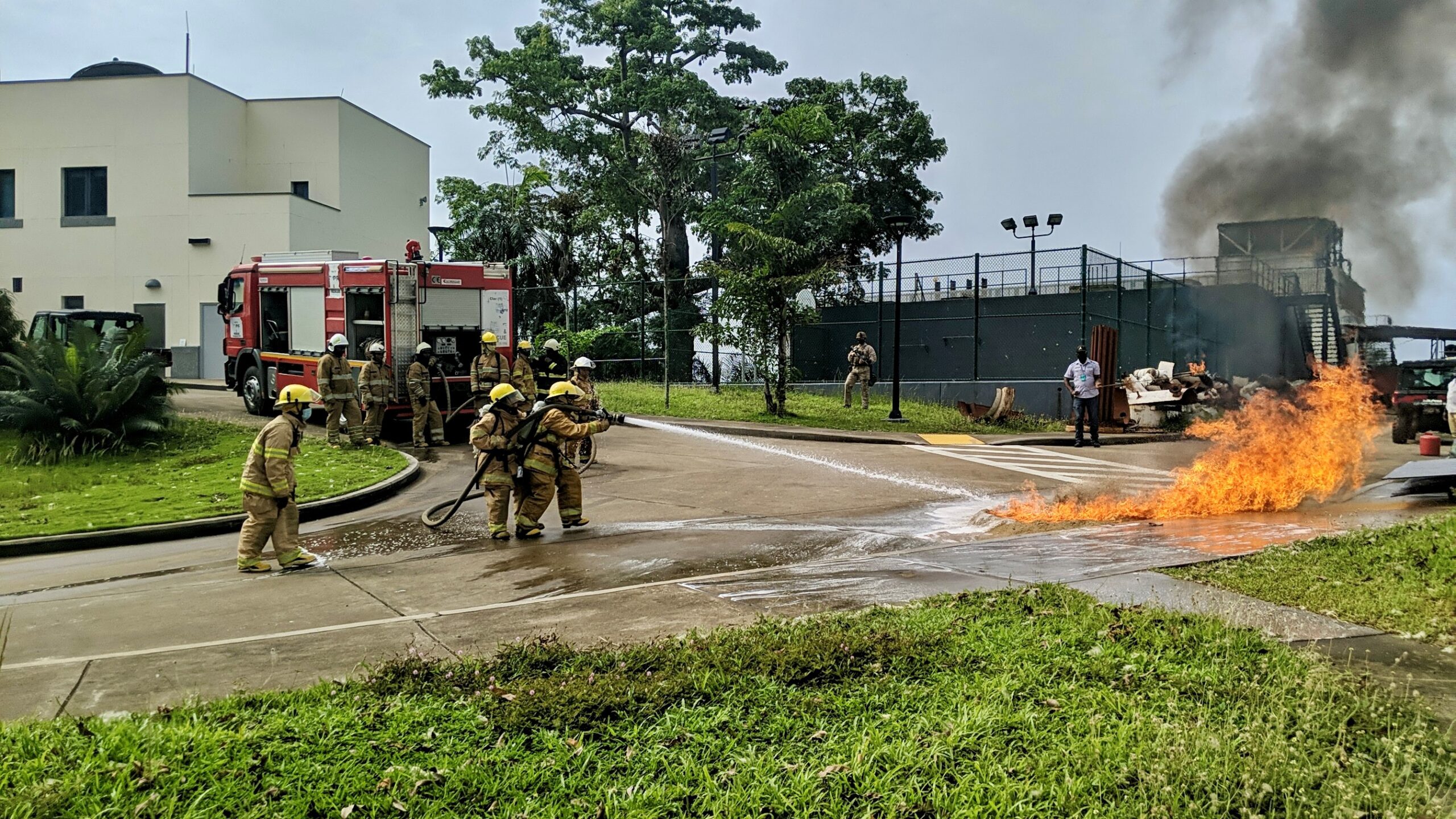 The Liberia Fire Service extinguishes a fire on the U.S. Embassy Monrovia compound during a fire drill, Monrovia, Liberia, March 2021. (U.S. Department of State photo)