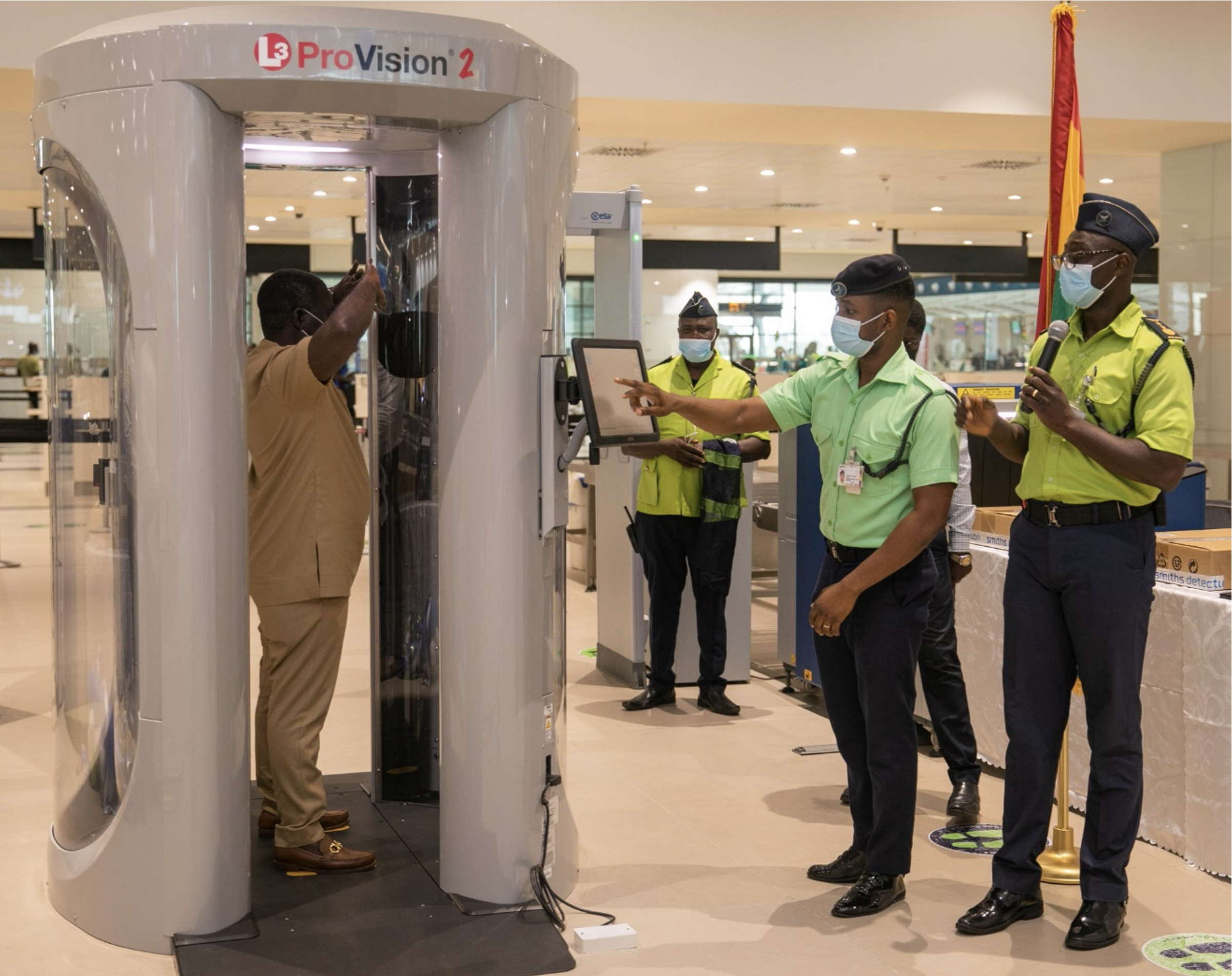 Ghana's Minister of Transport Kwaku Ofori Asiamah tests a body scanner, which is part of aviation security equipment presented to authorities of the Kotoka International Airport on March 23, 2021, as part of an ATA equipment grant. (U.S. Department of State photo)