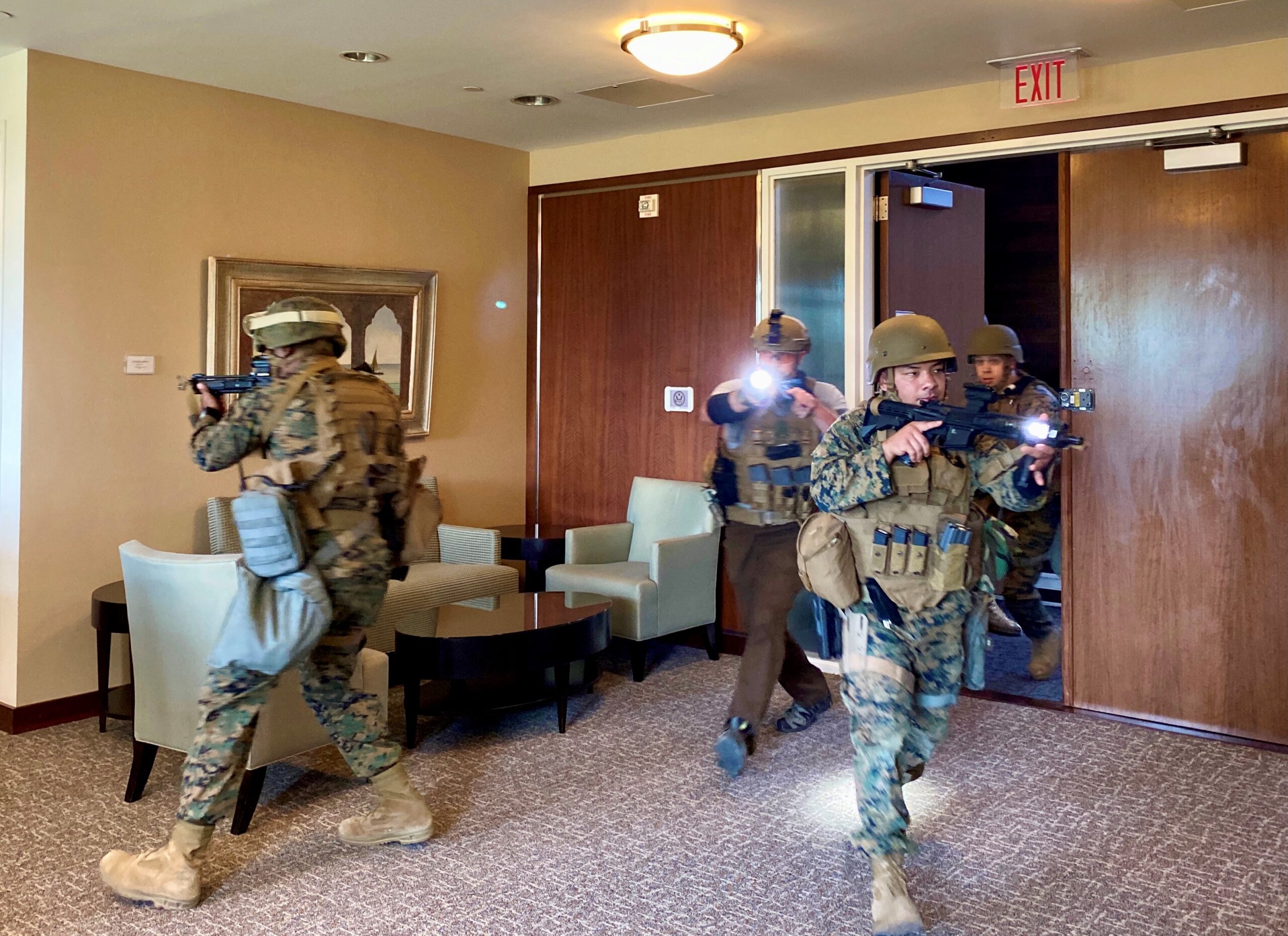DSS special agents and Marine Security Guards enter the embassy's executive suite in search of an armed intruder during an exercise at the U.S. Embassy in Dar es Salaam, Tanzania on July 6, 2021. (U.S. Department of State photo).