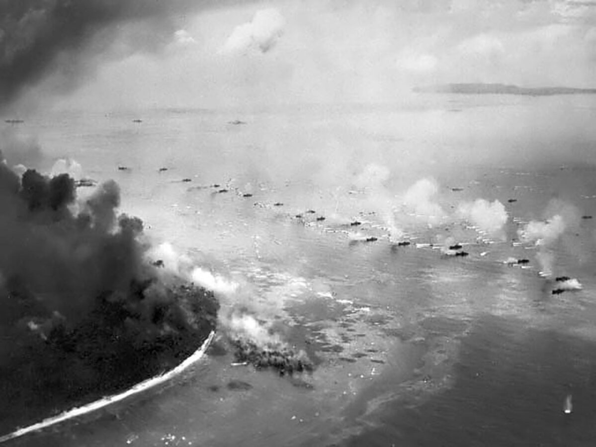 A black and white photo of landing vehicles moving toward beaches in Peleliu, Palau on September 15, 1944.