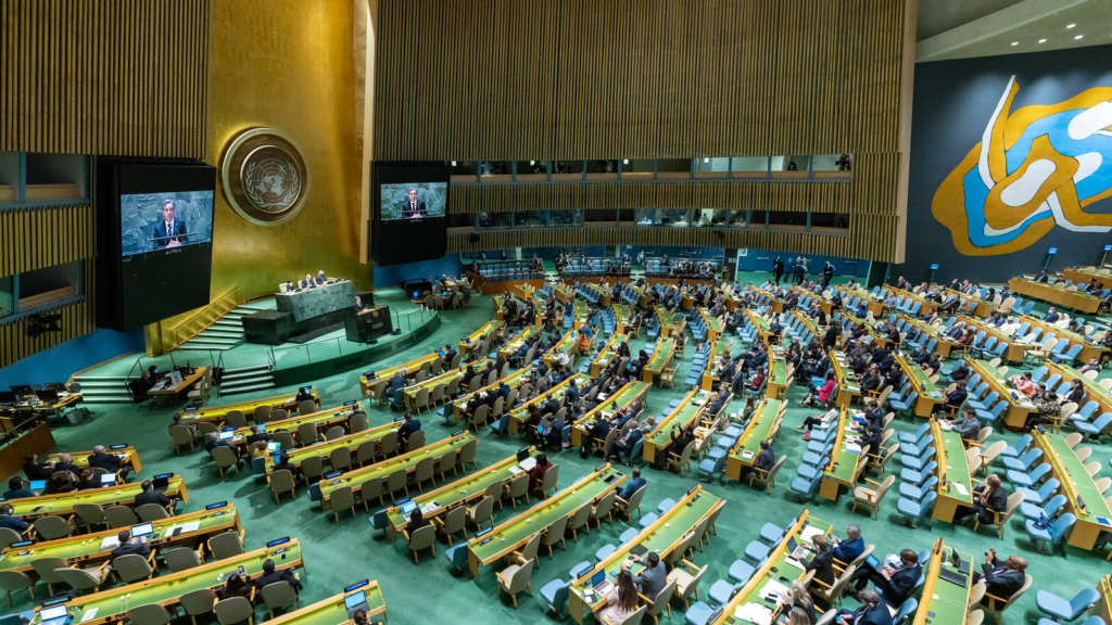 Secretary Blinken speaks in the United Nations General Assembly chambers.