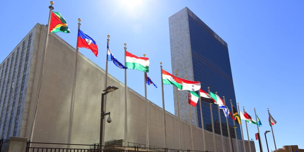 Flags flying in front the UN headquarters in NYC.