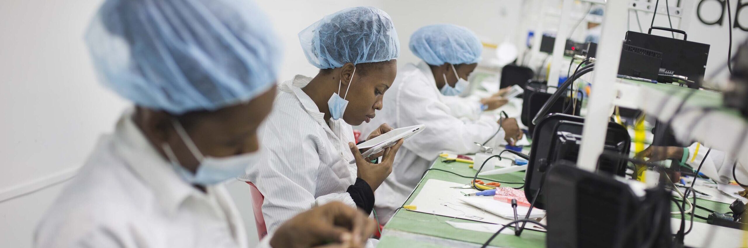 Haitian women assembling tablets