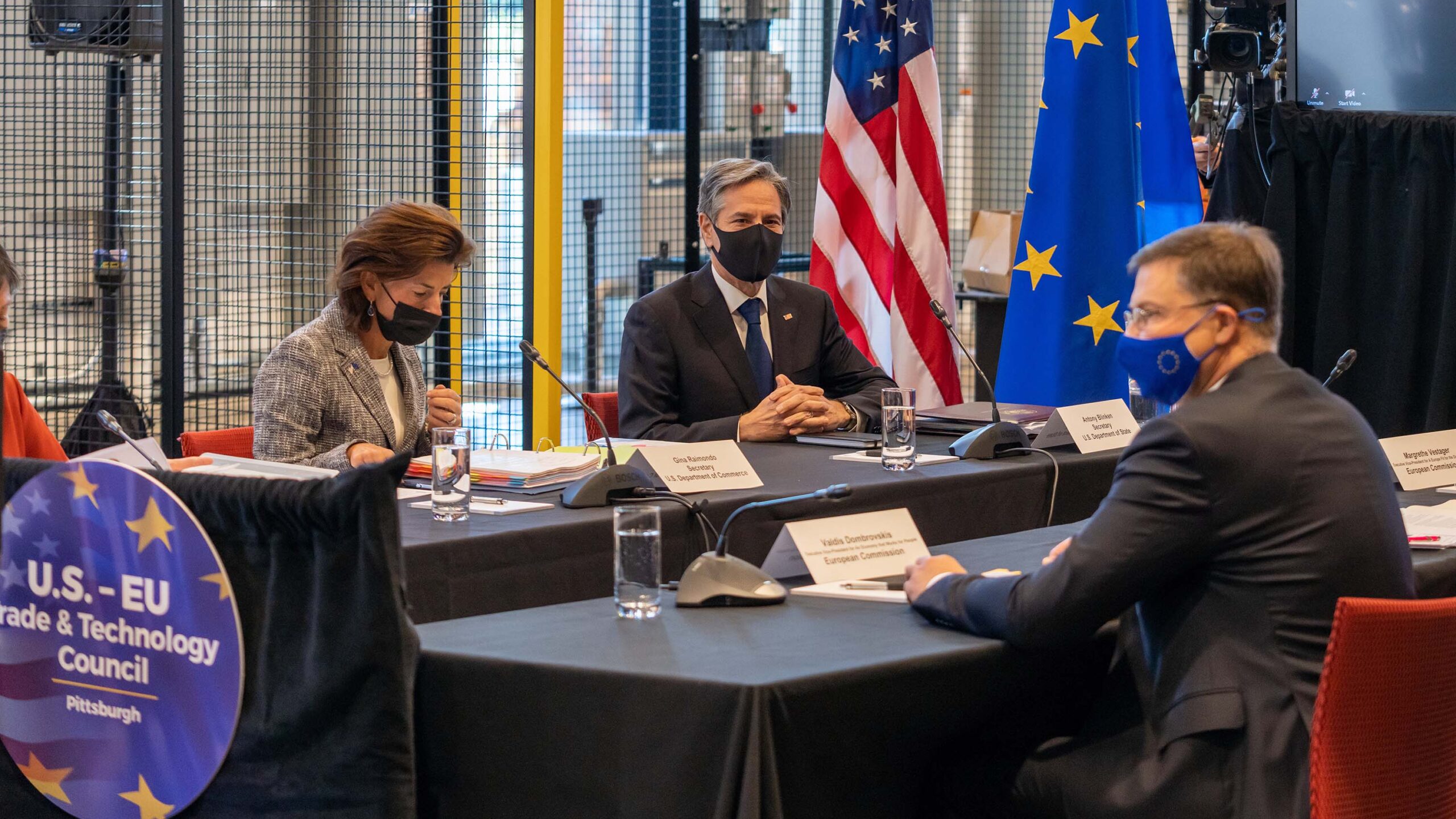 U.S. and EU leaders seated socially distanced at opposing tables