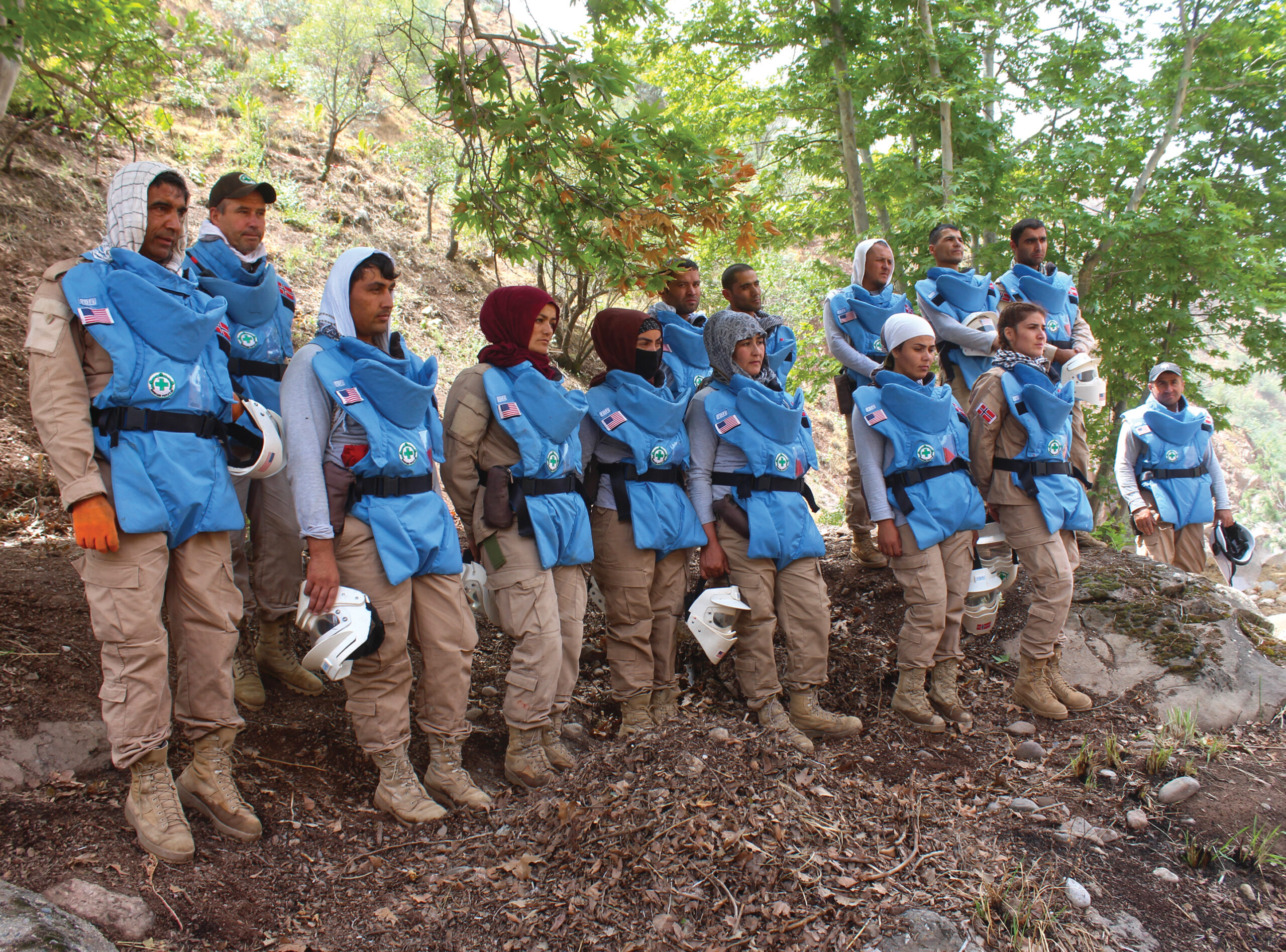 A group of people in protective gear standing together