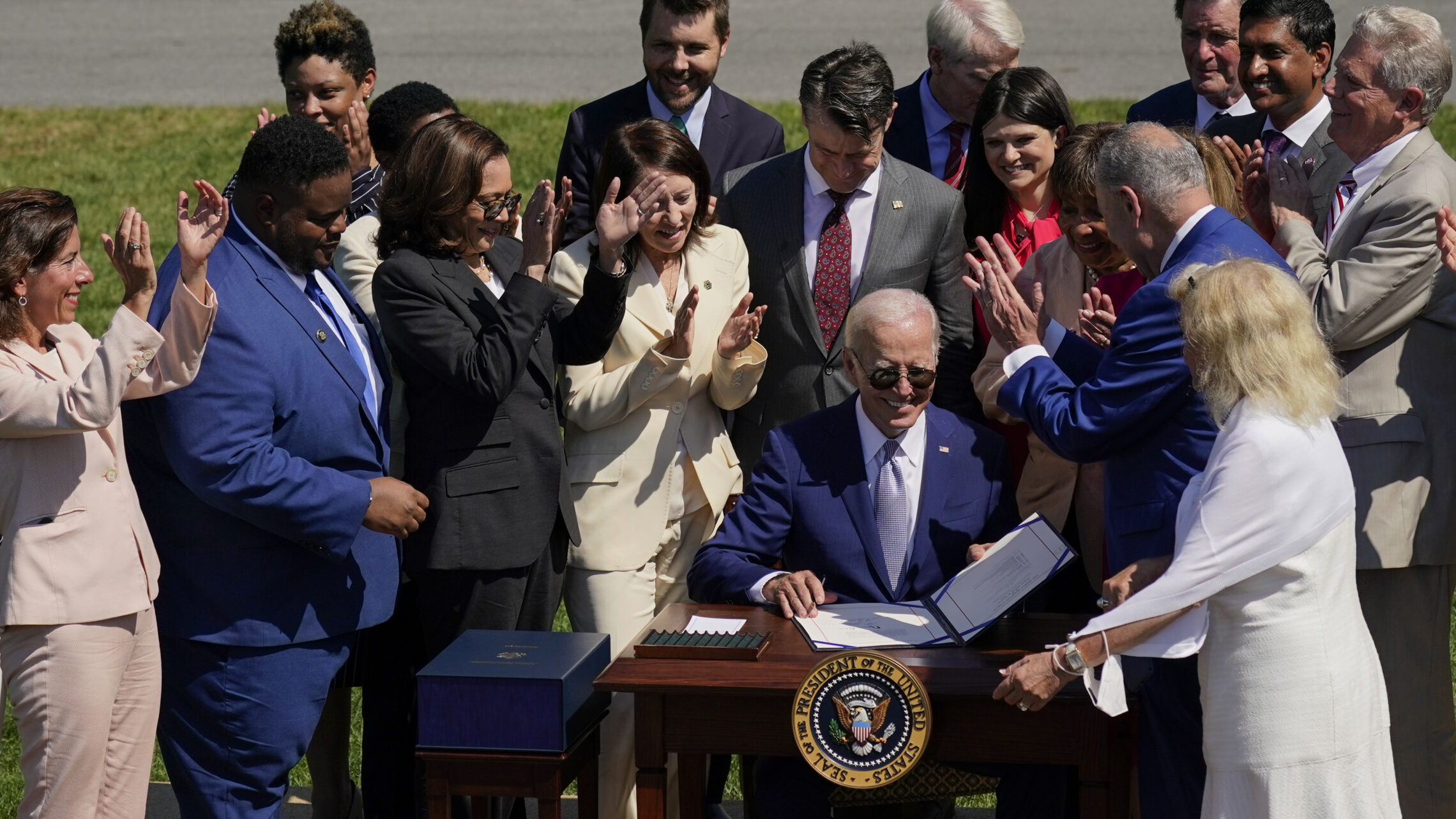 President Joe Biden is applauded after signing into law H.R. 4346, the CHIPS and Science Act of 2022, at the White House in Washington, Tuesday, Aug. 9, 2022.