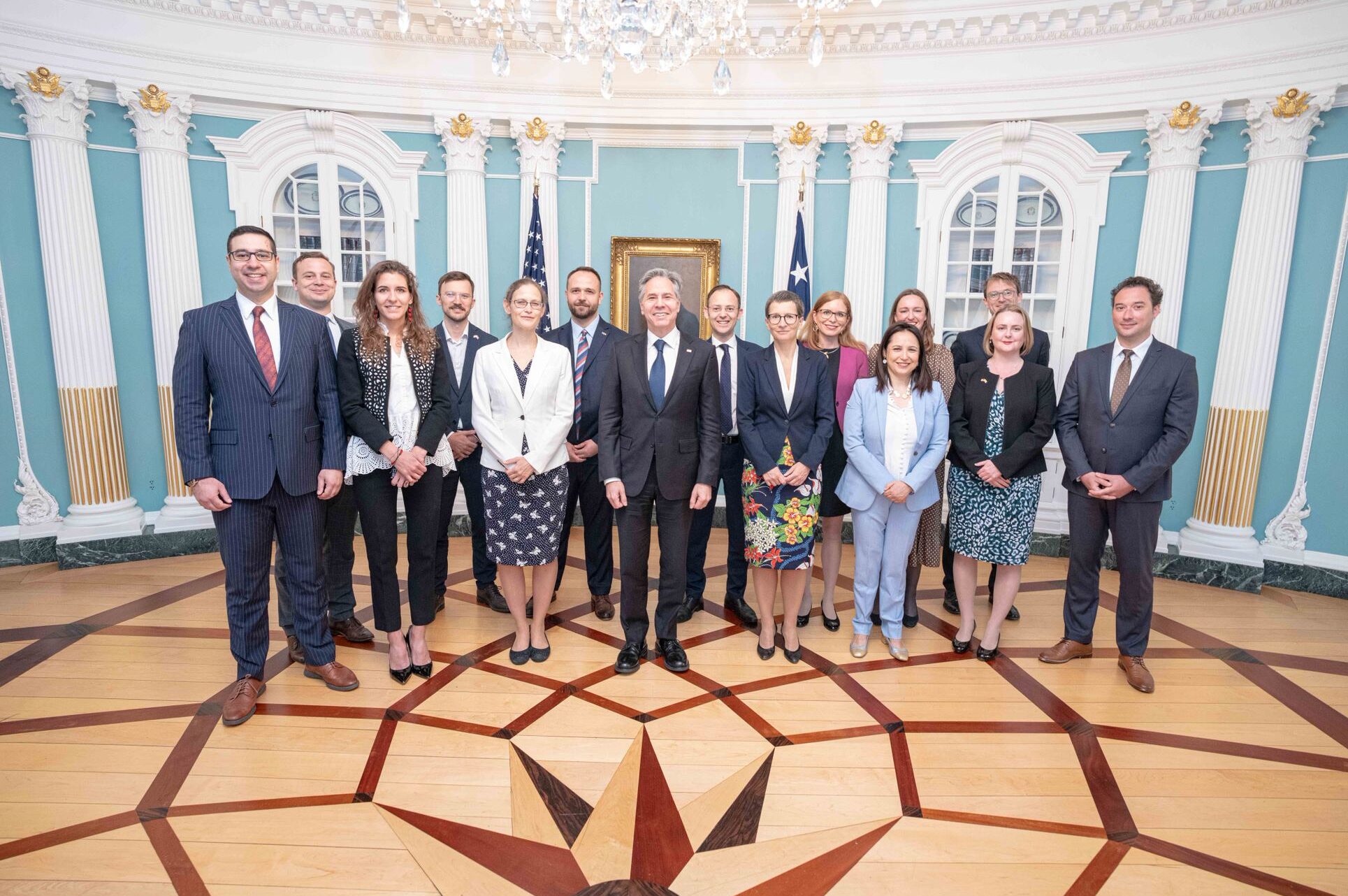 The cohort of Transatlantic Diplomatic Fellows pose for a photo with Secretary of State Antony Blinken.