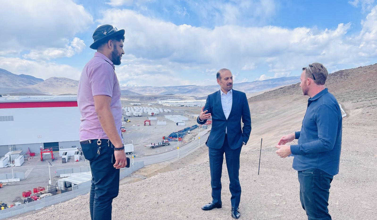 Special Representative Syed stands outside with Tesla reps at the Tesla/Panasonic Gigafactory outside of Reno, Nevada.