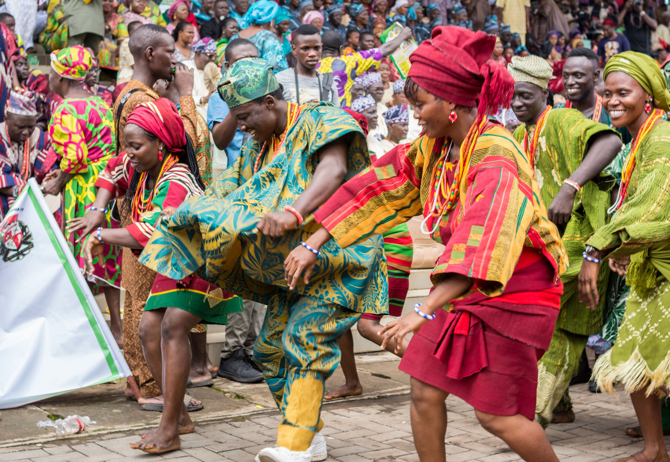 IJEBU ODE, OGUN STATE, NIGERIA- AUGUST 23, 2018: Members of a cultural troupe dances to entertain spectators during the Ojude Oba festival in Ijebu Ode, Ogun State.
