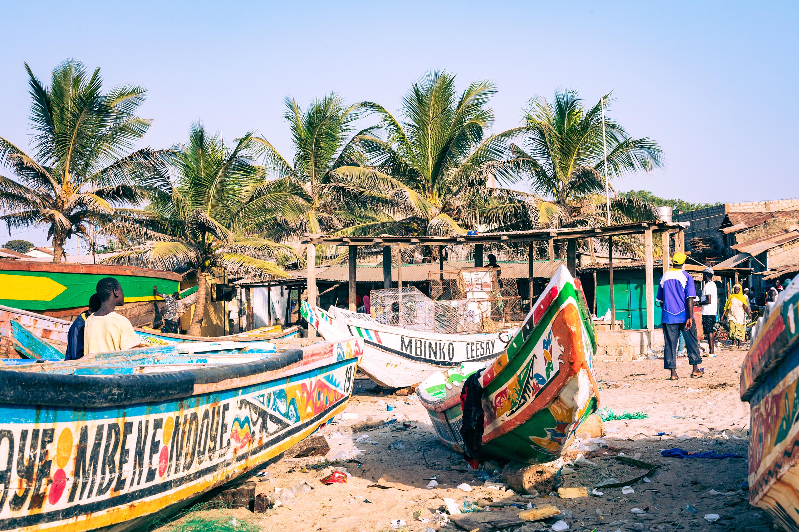 TANJI, THE GAMBIA - NOVEMBER 21, 2019: Traditional fishing boats in Tanji. Fishing village. Gambia, West Africa.