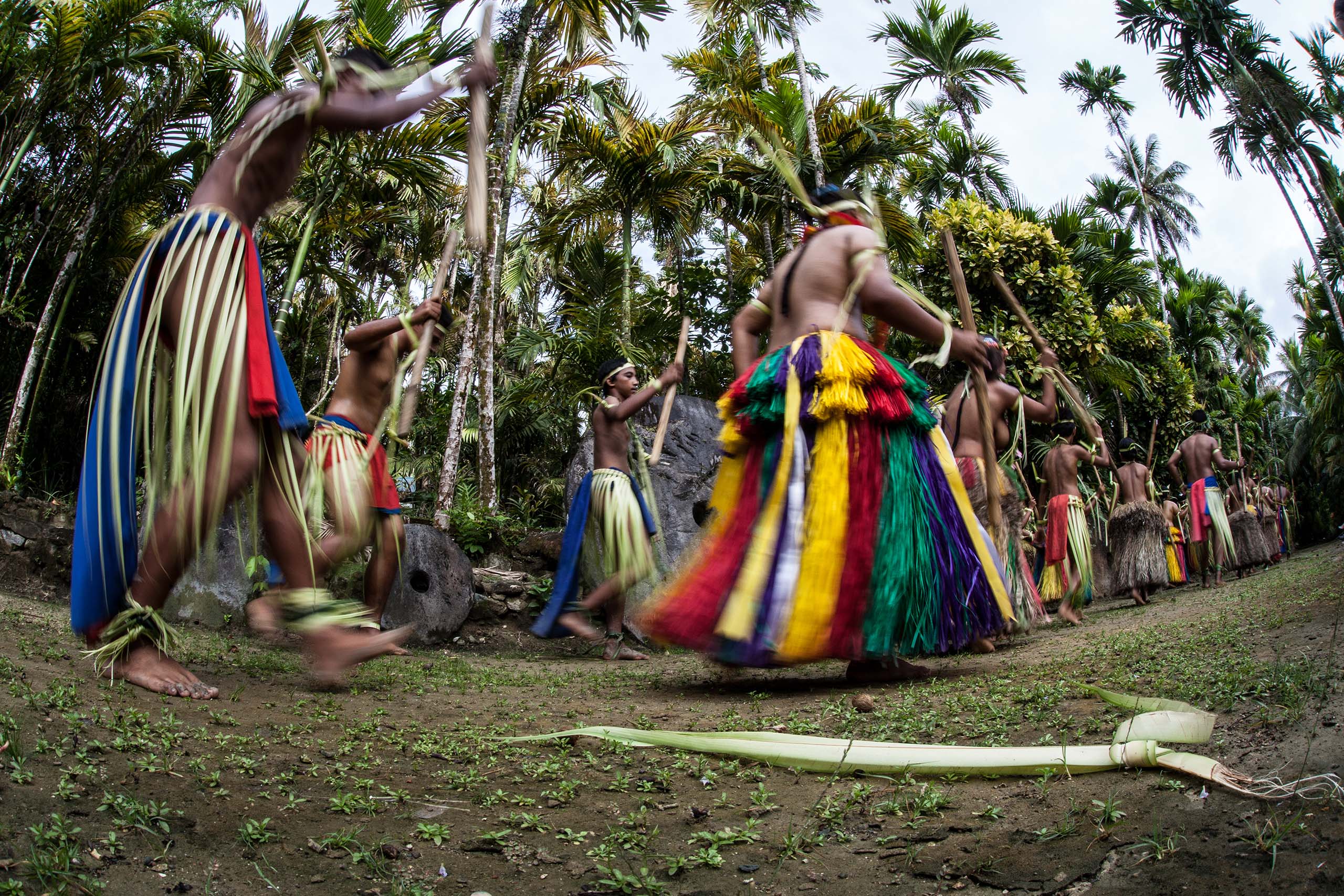 Young dancers from a local village on the Micronesian island of Yap perform traditional dances that have been passed down for generations. This idyllic island has held onto its culture over time.