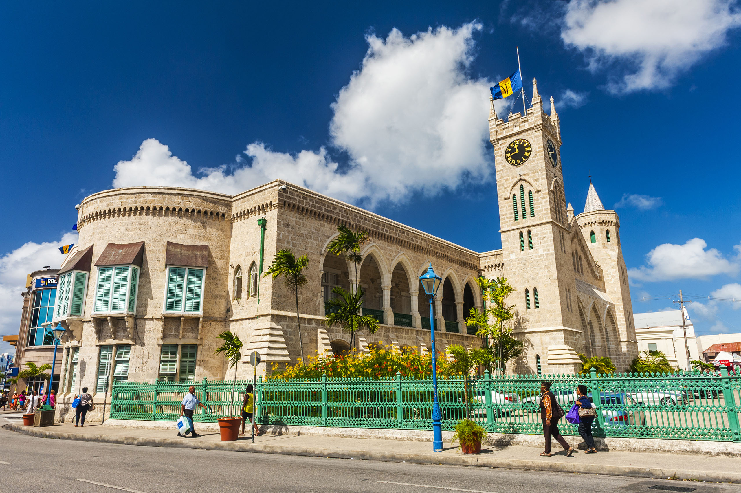 BRIDGETOWN, BARBADOS - DECEMBER 12, 2013: People walking in front of Parliament government building which is located on Broad Street