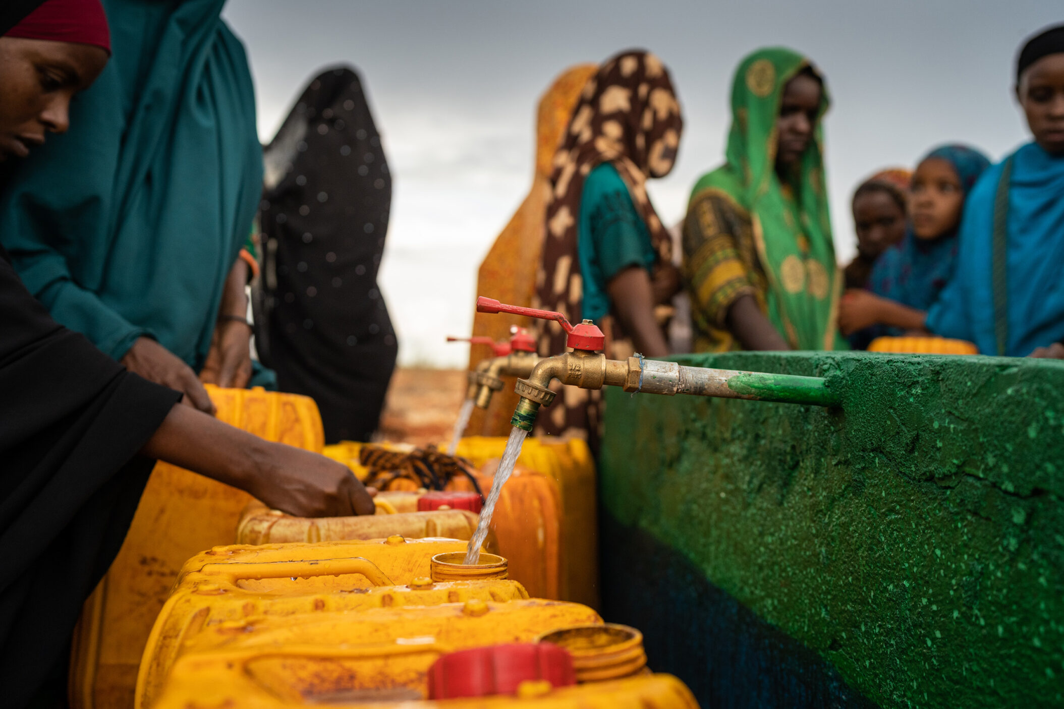 Baidoa, Somalia May 15, 2019: Women and children who are prepared to carry water and carry water on their heads