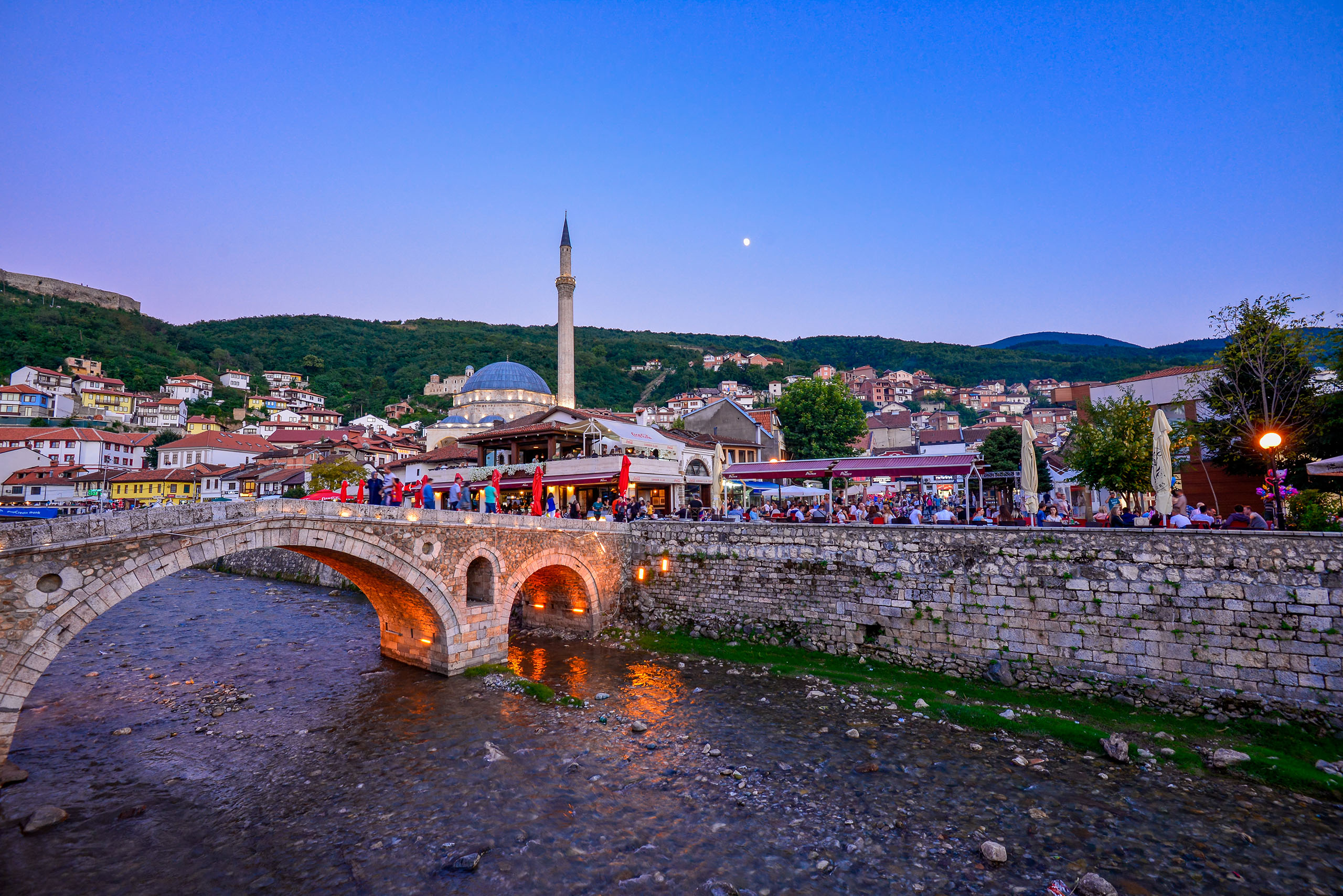 Prizren, Kosovo: August 18, 2016 - Beautiful view looking over the old bridge to the residence and urban areas by the creek in an old town in Prizren, Kosovo.