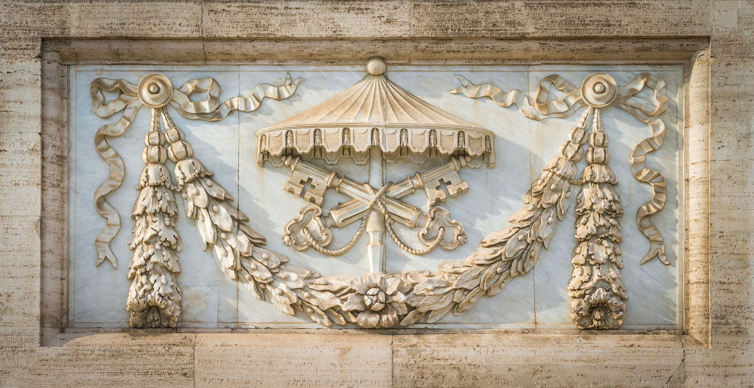 The arms of the Holy See under sede vacante, on the facade of the Basilica of Saint John Lateran in Rome, Italy.