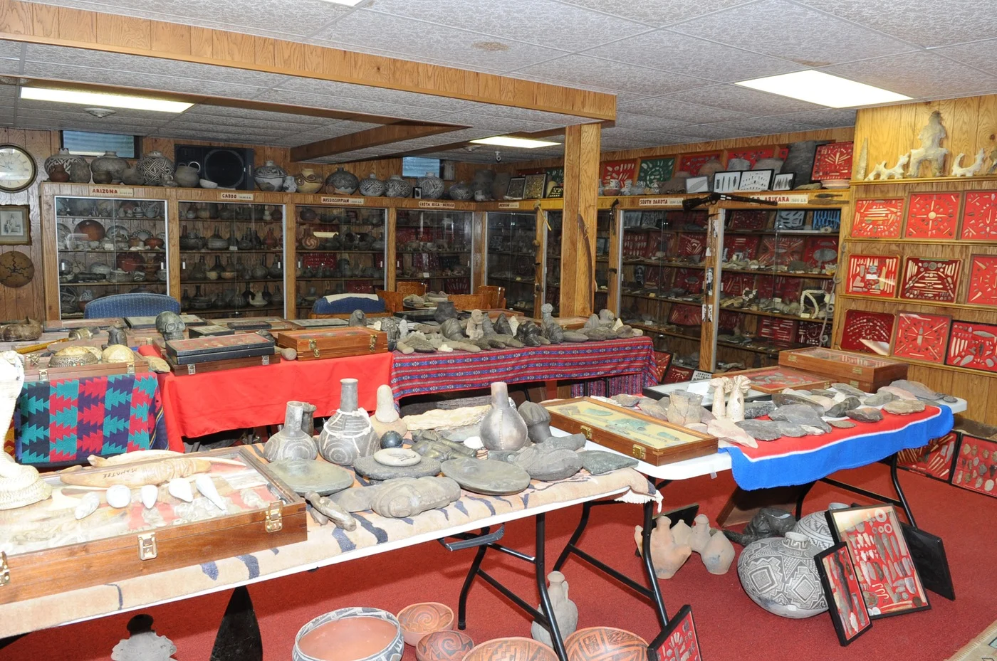 Cultural artifacts from North America, South America, Asia, the Caribbean, and in Indo-Pacific regions fill a room.