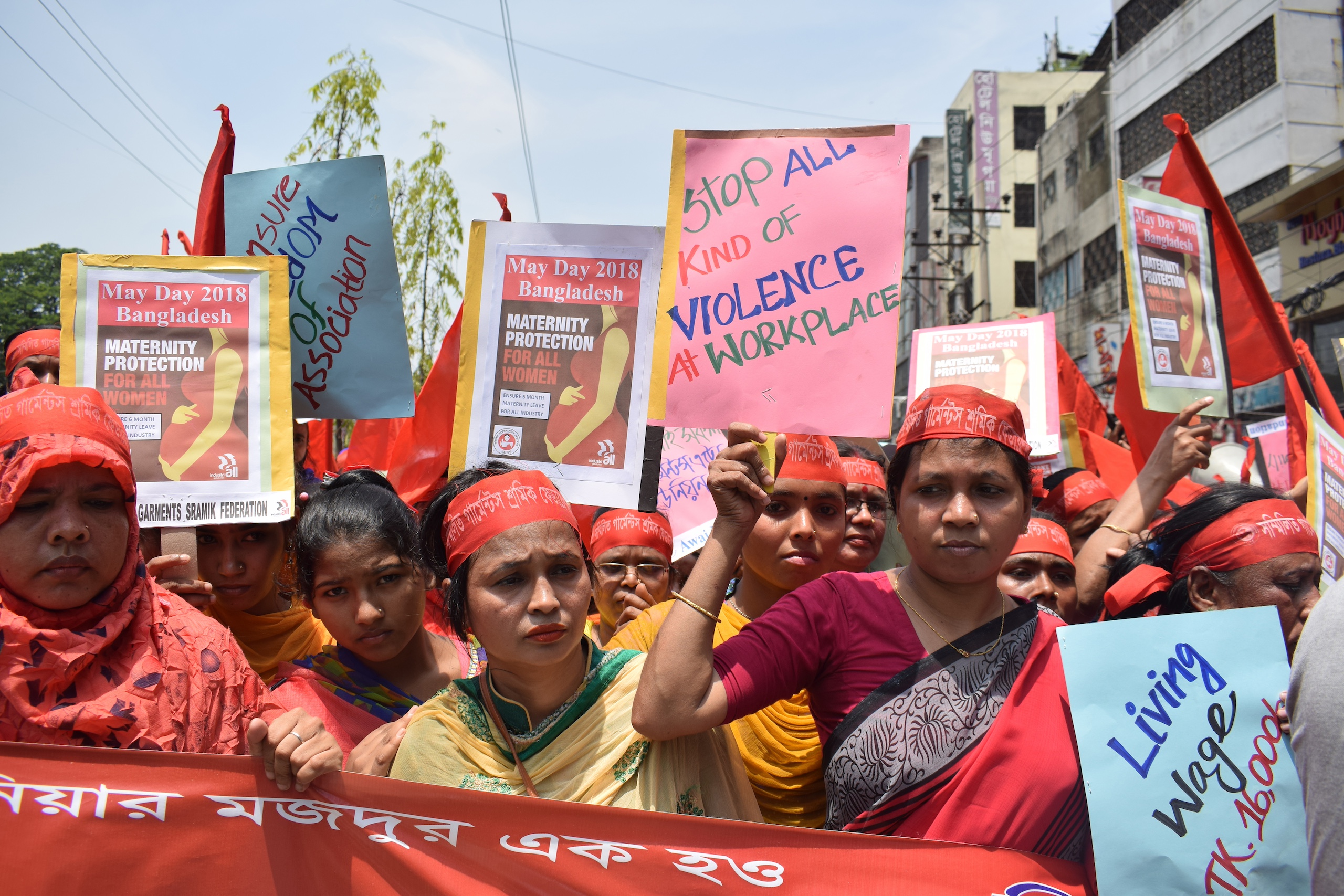 On May 1, 2018, women rally for a living wage, maternity protections, freedom of association and an end to gender-based violence at work, alongside labor rights organization and Solidarity Center partner Awaj Foundation near the Dhaka Press Club. Bangladesh’s ready-made garment industry is the country’s biggest export earner. However, wages are the lowest among major garment-manufacturing nations. Without a union, garment workers, the majority who are women, are often harassed or fired when they ask their employer to fix workplace hazards or seek living wages. Photo Credit: Musfiq Tajwar, Solidarity Center.